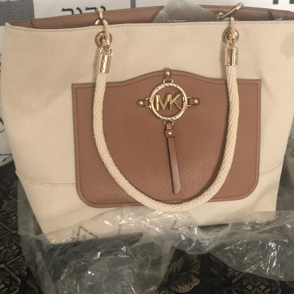 This Is A Almond Colored Micheal Kors Tote Bag With Gold Accents.